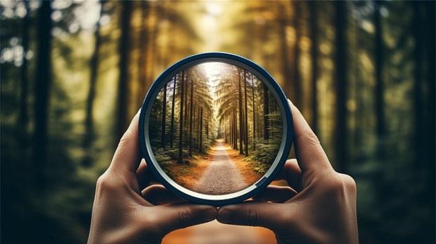 person-holding-magnifying-glass-their-hand-1-scaled